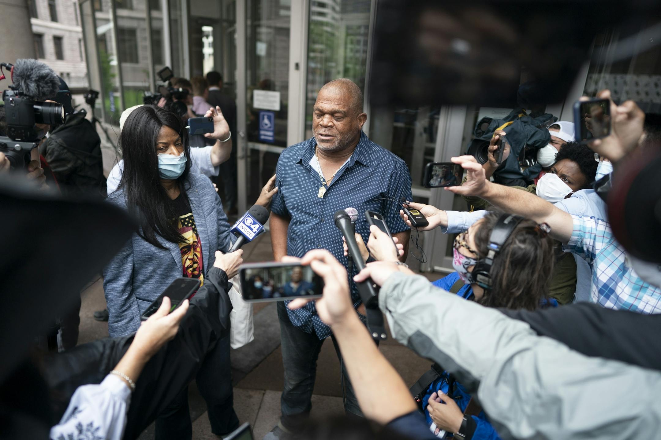 George Floyd aunt Angela Harrelson of Minneapolis left and his uncle Selwyn Jones of Gettysburg, South Dakota spoke to the members of the media outside of the Hennepin County Public Safety Facility Monday morning .