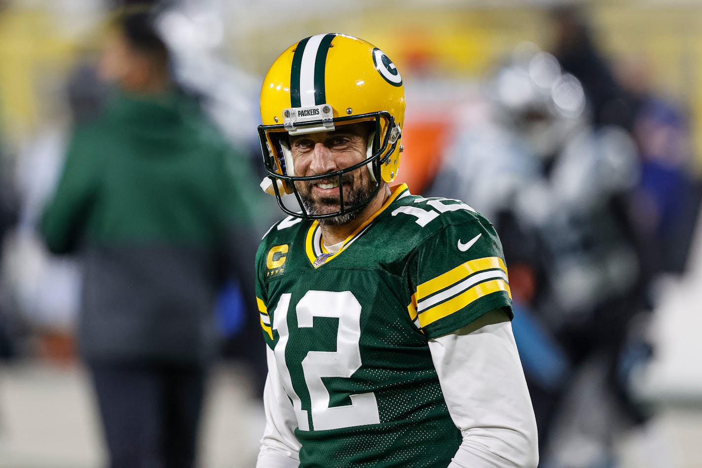 Green Bay Packers quarterback Aaron Rodgers (12) smiles before an NFL football game, Saturday, Dec 19. 2020, between the Carolina Panthers and Green Bay Packers in Green Bay, Wis. (AP Photo/Jeffrey Phelps)