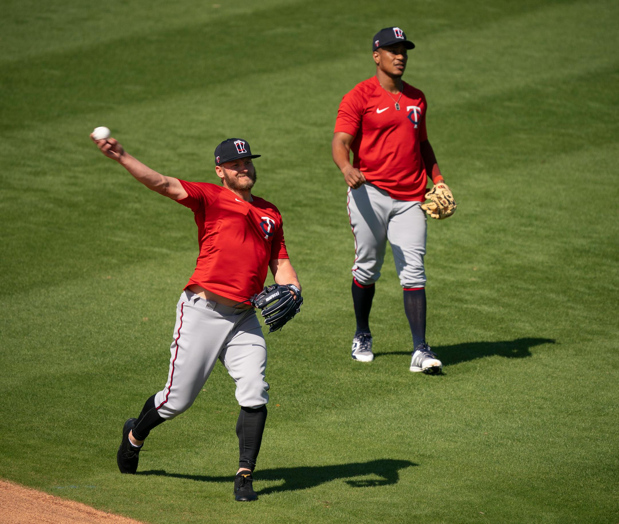 Twins third baseman Josh Donaldson played catch to loosen up next to Twins infielder Jorge Polanco at the start of the first full squad workout Tuesday morning.