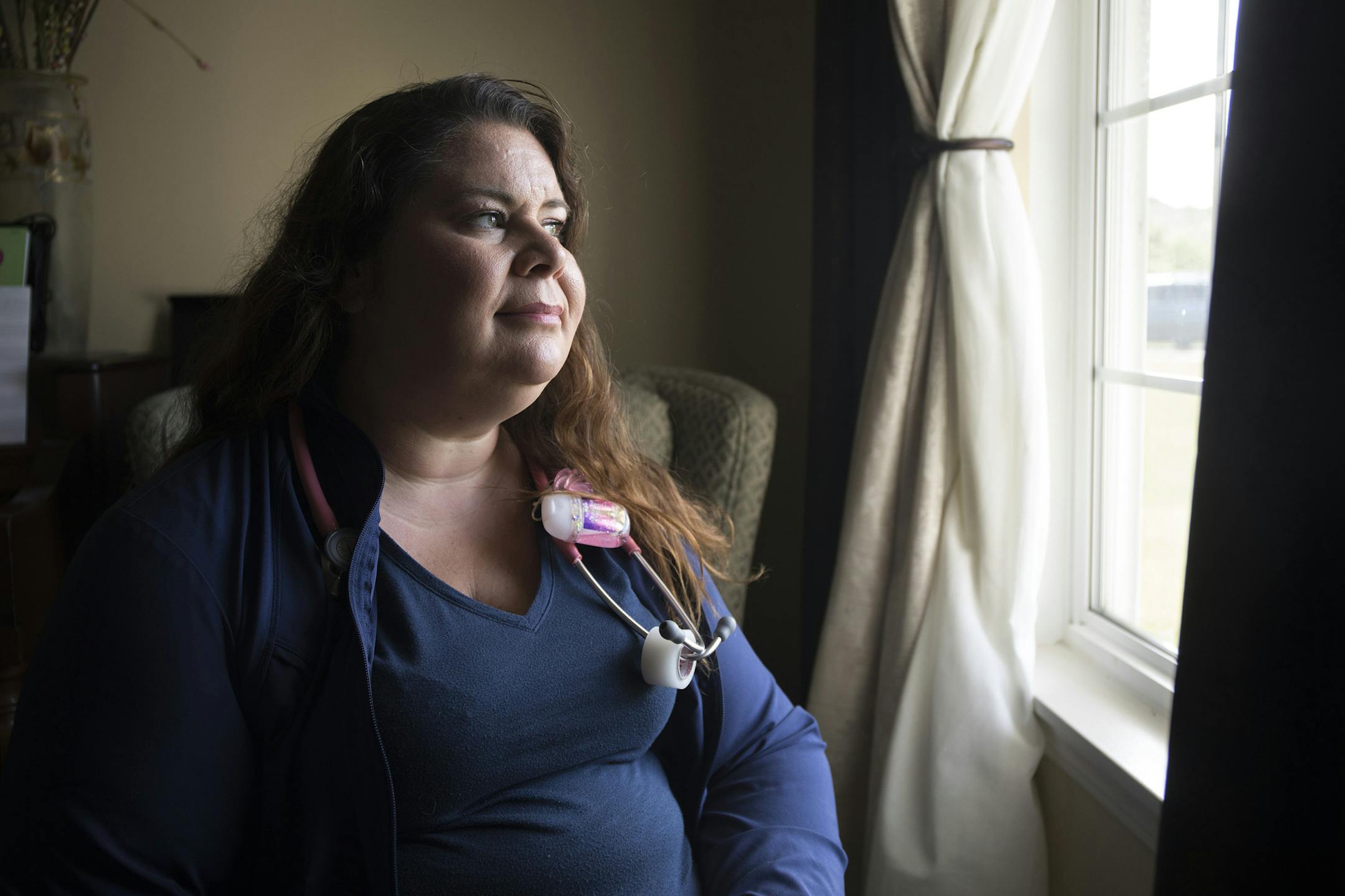 Carina Johannessen, an emergency room nurse, poses for a portrait in her home in Joliet, Ill., on Monday, July 31, 2017. (Alexandra Wimley/Chicago Tribune/TNS)