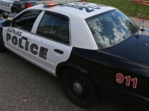 Hopkins police officers gathered before entering the hallways of Alice Smith Elementary School in Hopkins during an active shooter training exercise on 10/26/13. The weapons carried a form of paint ball ammo. Over forty people representing Hopkins Police, Hopkins Fire, Hennepin EMS, Hennepin Sheriff's dispatch and the Hopkins School District took part in the exercise. In light of the increased shootings at schools and workplaces across the country, Hopkins Police are increasing shooter training