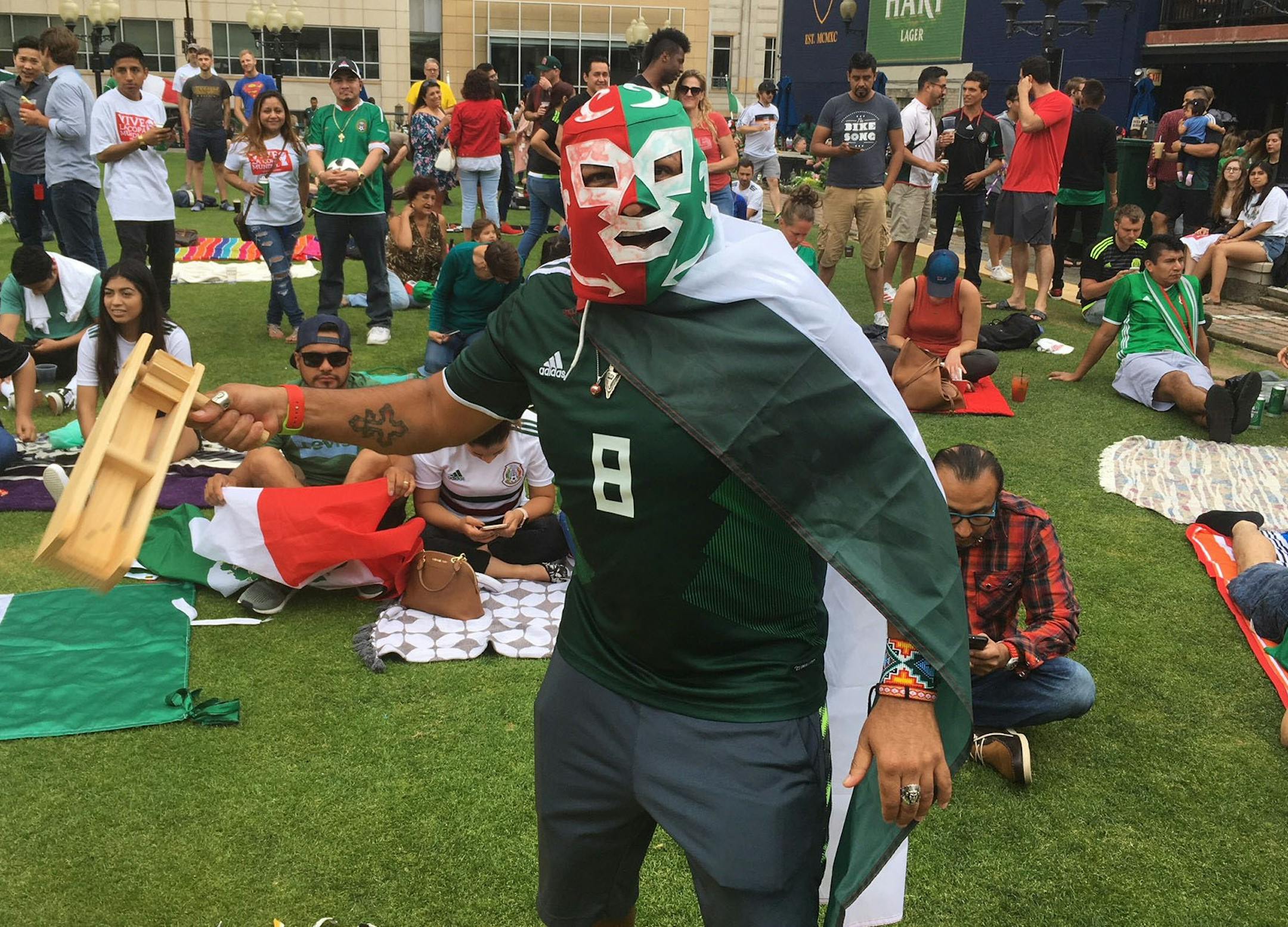 Mexico fan Victor Martinez, 48, of Minneapolis shows off his matraca at Brit's Pub during halftime of Mexico's match vs. Sweden on Wednesday. photo/Michael Rand