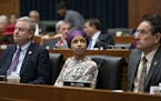 Rep. Ilhan Omar, D-Minn., sits with fellow Democrats David Trone of Maryland, left, and Andy Levin, of Michigan, right, at a session of the House Educ