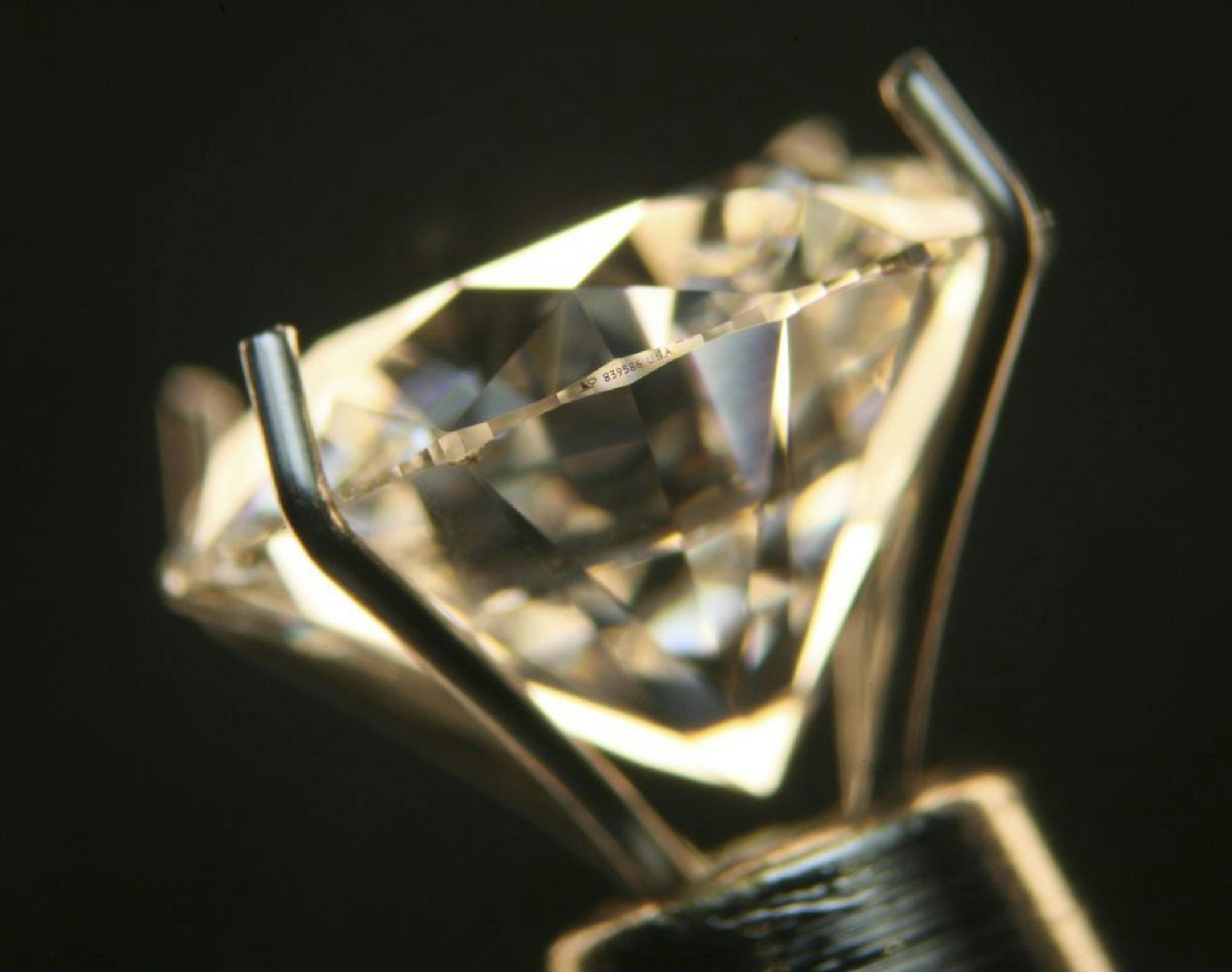 The laser inscribed hallmark number on a 1.85 carat Lazare Diamond, photographed at R.F. Moeller Jeweler in St. Paul Tuesday evening.