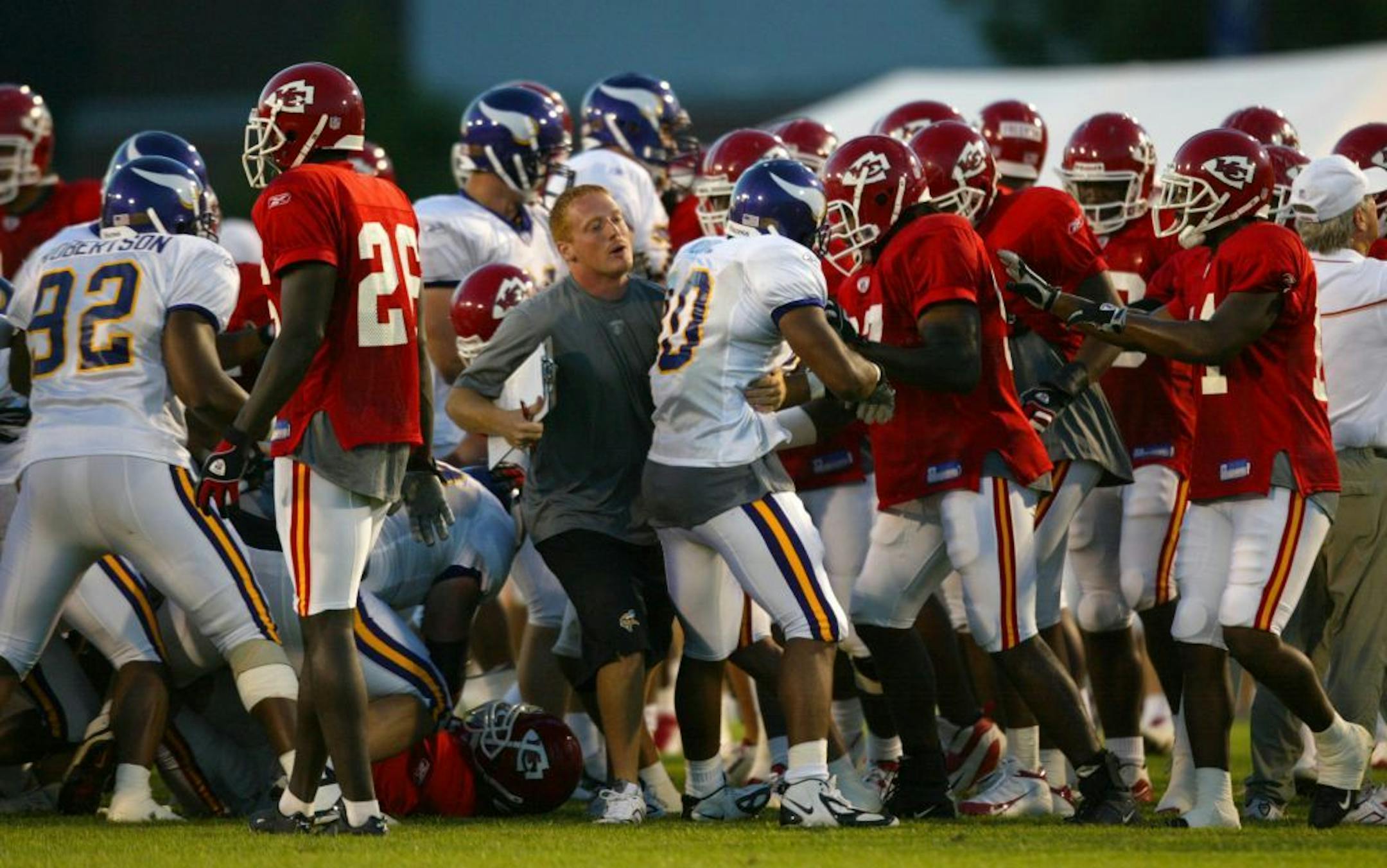 Hard hits, including some by pro wrestler Brock Lesnar during a 2004 tryout with the Vikings, led to scenes like this one during a joint scrimmage with Kansas City. Lesnar wrestled in college for the University of Minnesota.