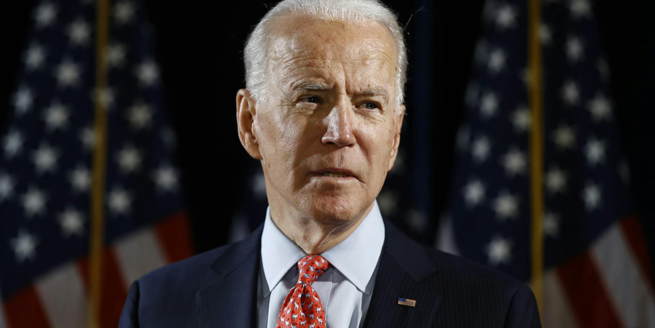 FILE - In this March 12, 2020, file photo Democratic presidential candidate former Vice President Joe Biden speaks about the coronavirus in Wilmington, Del. With the launch of his live-streamed web videos, weekly podcast and a new email newsletter, Joe Biden is building an online media presence since the coronavirus outbreak essentially froze traditional campaigning. (AP Photo/Matt Rourke, File)