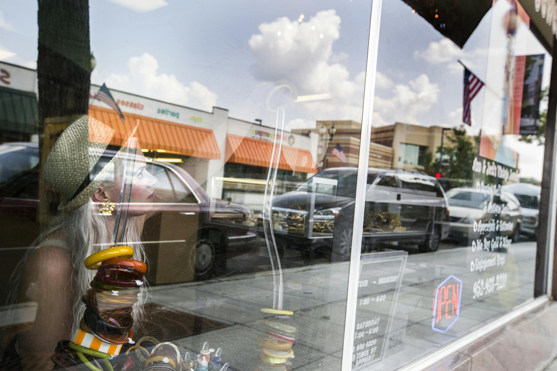 Nikolina Erickson-Gunther of Minneapolis shops at Ann & Jack's Vintage Jewelry on Mainstreet in Hopkins on Tuesday, July 14, 2015.