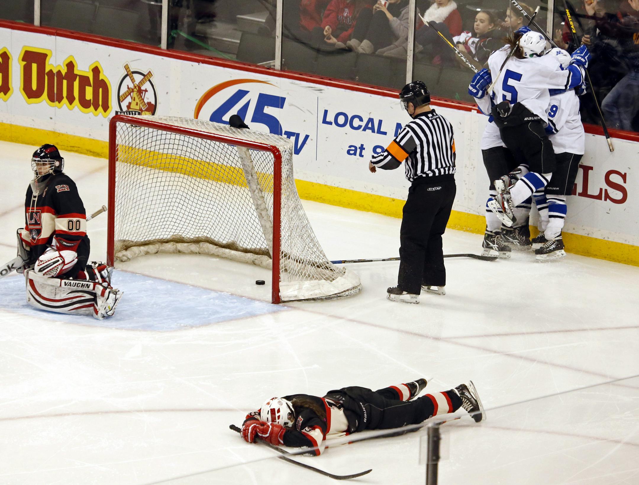 Amy Petersen (#9 top right) scored the game winning goal in the 6th Overtime period against Eden Prairie.
