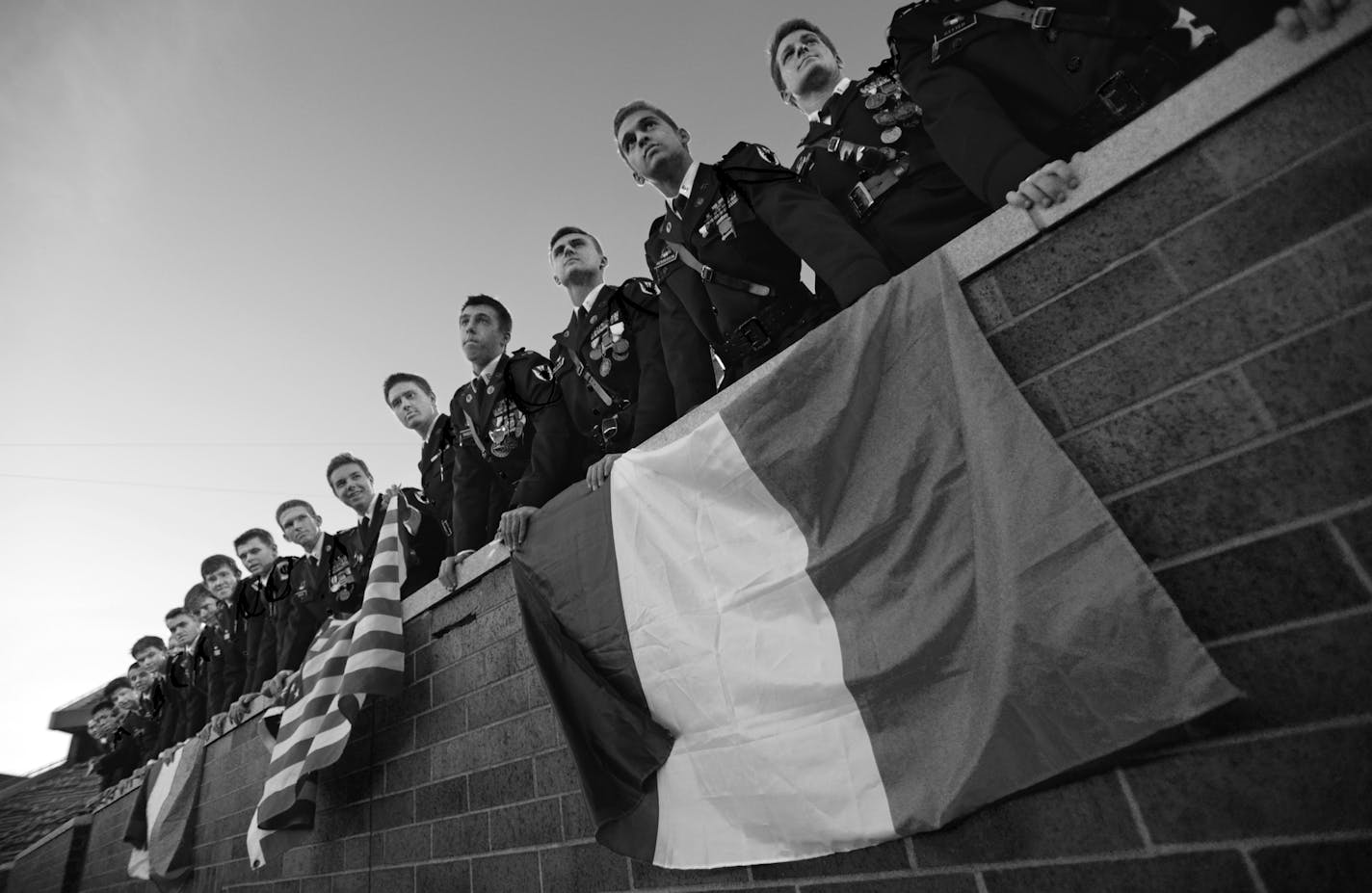 St. Thomas Academy students held up French and American flags during Saturday's 5A championship game against St. Michael-Albertville. ] (AARON LAVINSKY/STAR TRIBUNE) aaron.lavinsky@startribune.com St. Thomas Academy played St. Michael-Albertville in the Class 5A championship game on Saturday, Nov. 14, 2015 at TCF Bank Stadium. ORG XMIT: MIN1511141742160282