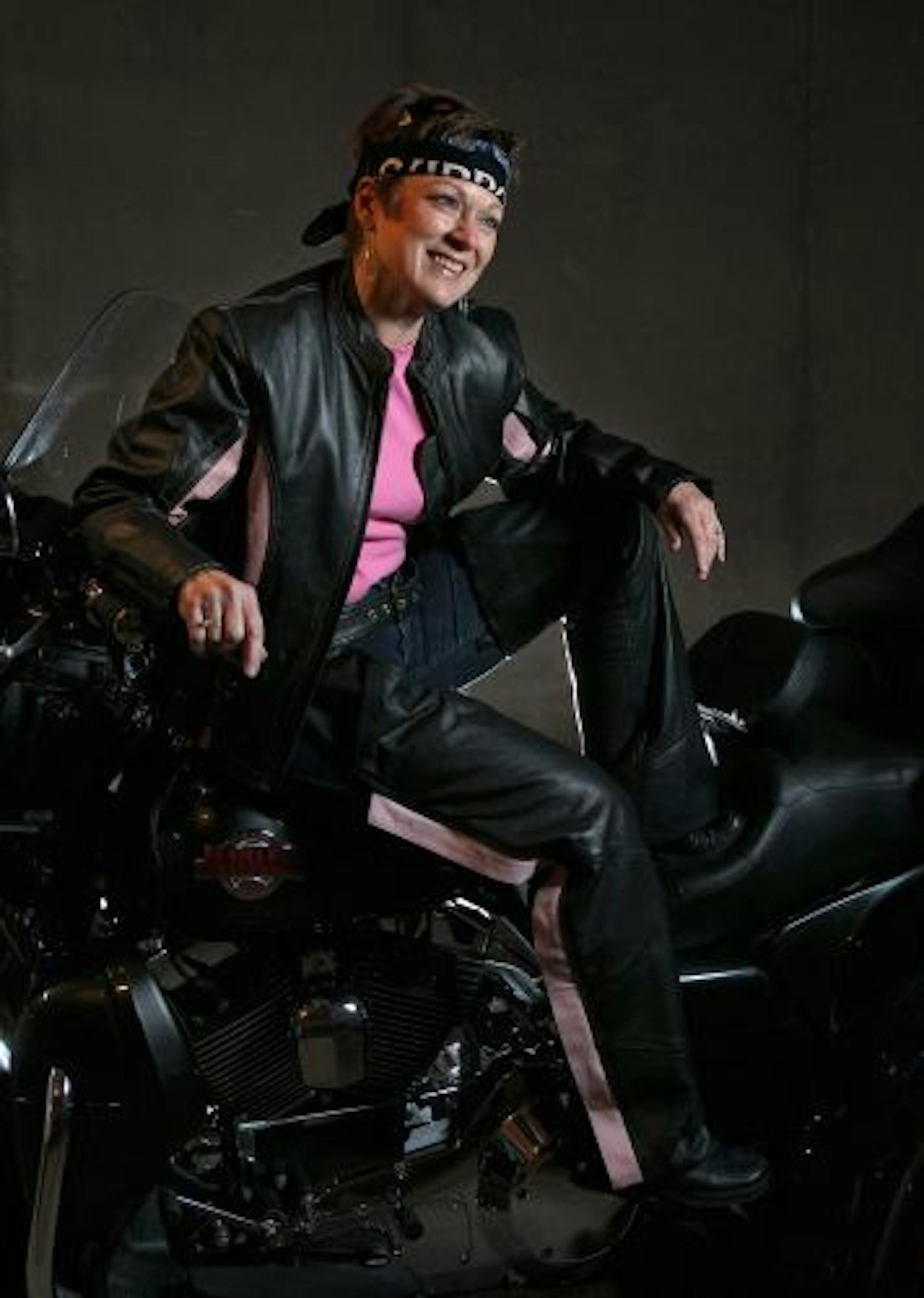 Pink is definitely in among style-conscious female motorcyclists. Barb Himelfarb of Bloomington sports the look in her top and accents on her jacket and chaps.