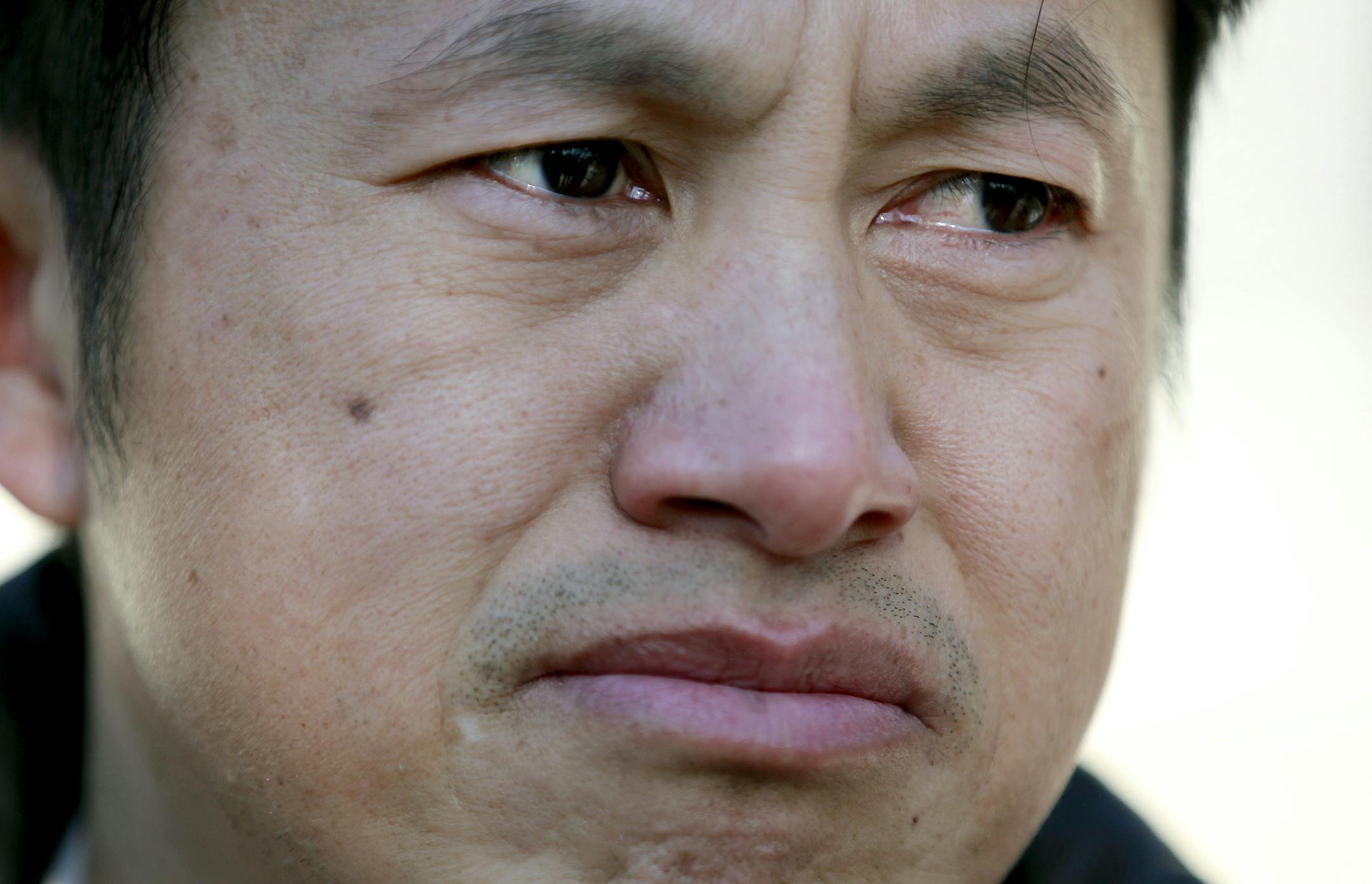 Michael Yang, the uncle of four-year-old fire victim Ntshialiag Yang, became emotional after he viewed the aftermath at 595 Jessamine Avenue, Monday, February 9, 2015 in St. Paul, MN. ] (ELIZABETH FLORES/STAR TRIBUNE) ELIZABETH FLORES &#x2022; eflores@startribune.com