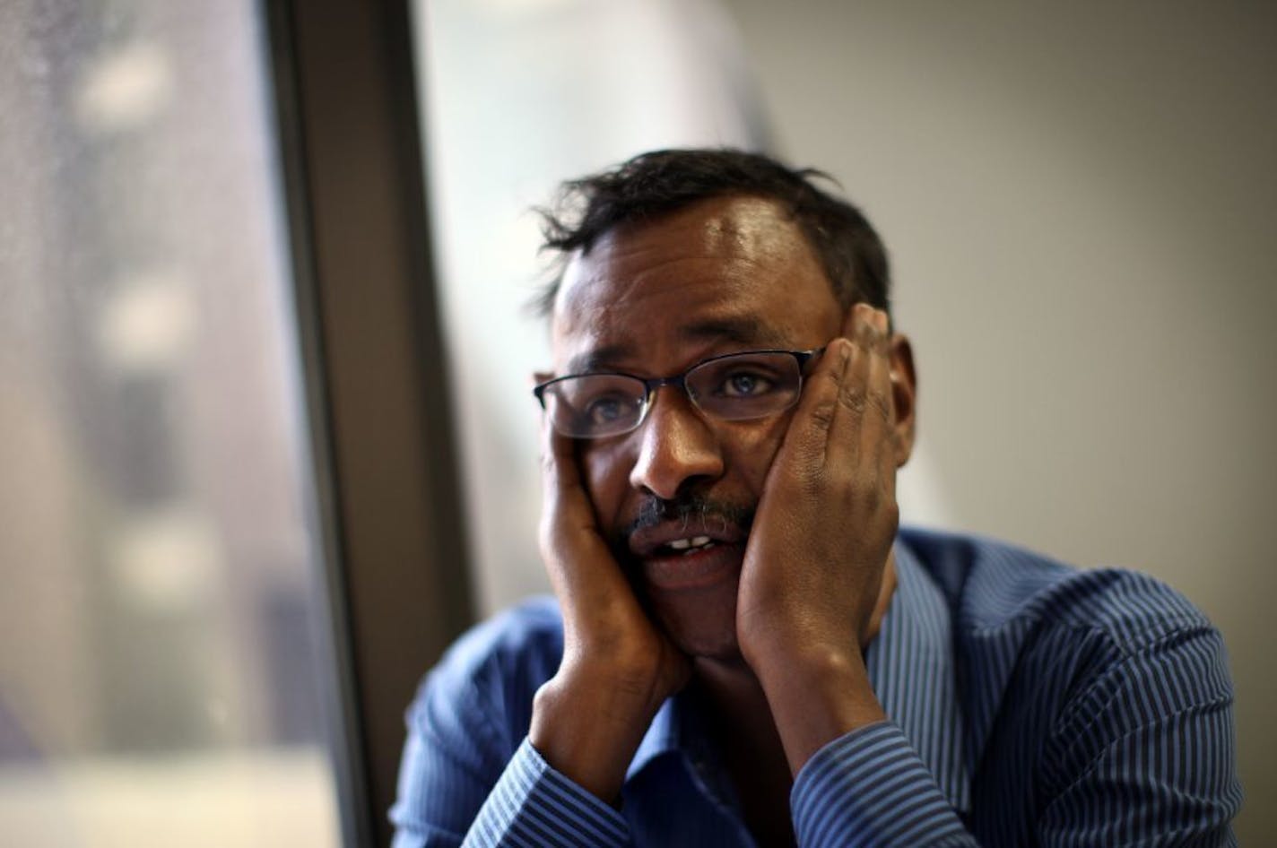 Abdisalan Hussein Ali blew himself up in an attack that killed at least 10 people in Somalia on Saturday may have been a U.S. citizen from Minneapolis who returned to Somalia three years ago. Here, Abdirizak Bihi, a Somali community activist in Minneapolis, said he knows two friends of Ali who listened to the audiotape and believe it is Ali. Bihi said he hoped to meet with Ali's mother, who had been in a support group with Bihi. Bihi lost a nephew, Burhan Hassan, 18, to violence in Somalia.