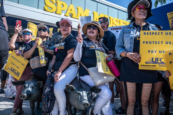 About 1,000 members of Local 663 stopped at the Spam Museum, raising as much noise as possible while onlookers took video on their phones, then headed