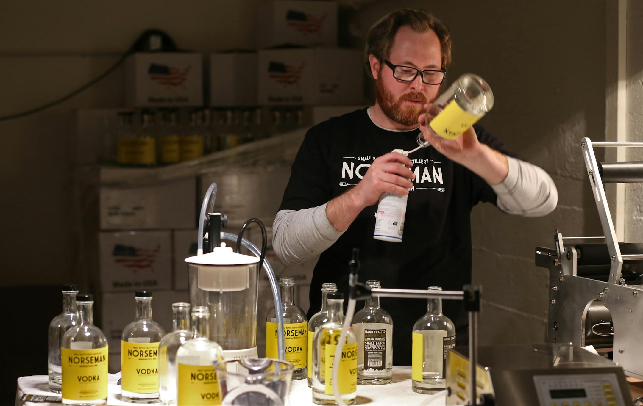 Scott Ervin cleaned bottles before filling with Norseman Vodka on 1/10/14. The year starts off with a high-proof bang, as micro-distillers open in the metro. One of the first to actually have product in stores and bars is the small Norseman Distillery in NE Mpls., run by Scott Ervin.] Bruce Bisping/Star Tribune bbisping@startribune.com Scott Ervin/source. ORG XMIT: MIN1401101403390655