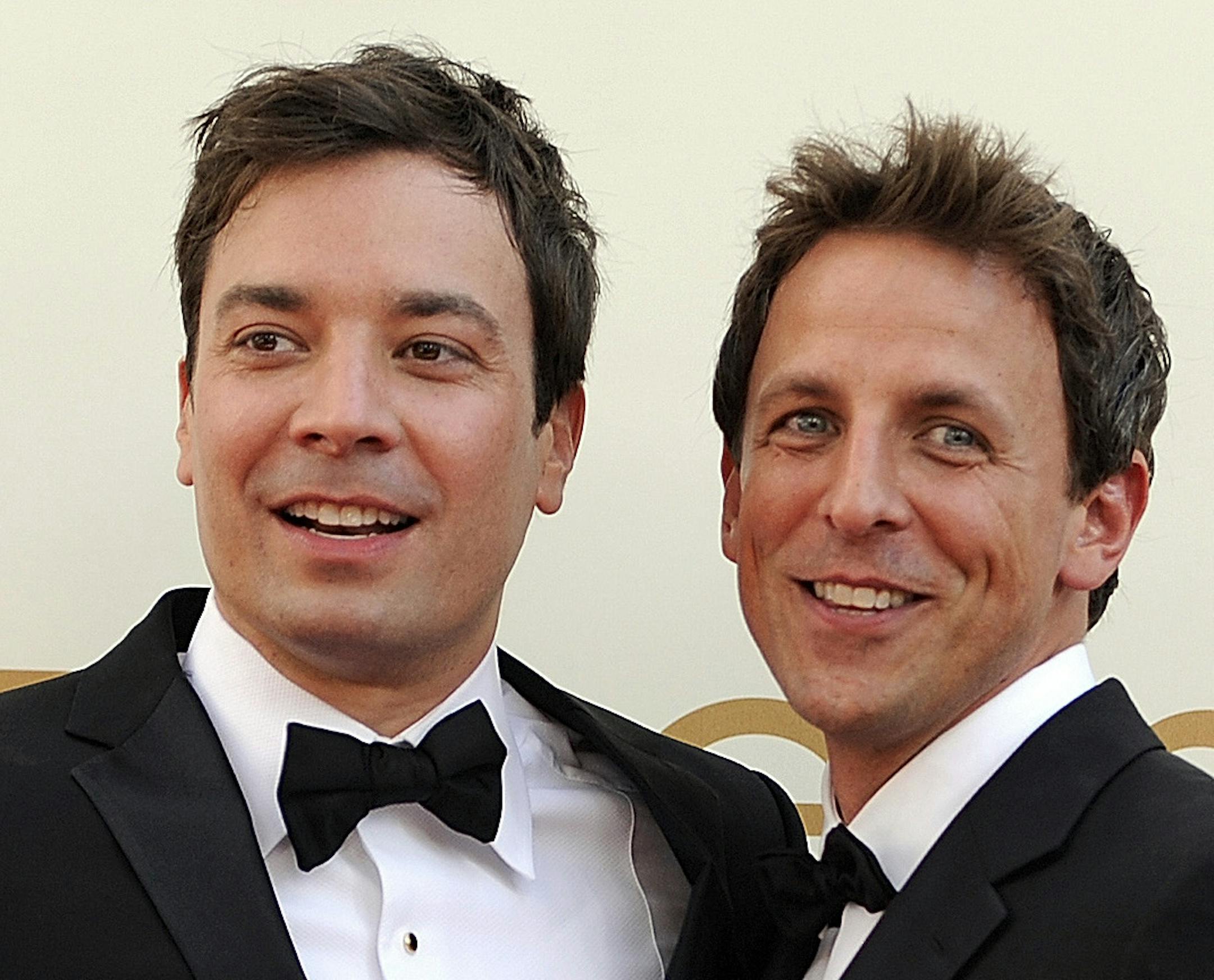 FILE This Sept. 18, 2011 file photo shows Jimmy Fallon, left, and Seth Meyers at the 63rd Primetime Emmy Awards in Los Angeles. Meyers is moving from his "Weekend Update" desk to his own late night show on NBC. The network said Sunday, May 12, 2013 that the longtime "Saturday Night Live" cast member will replace Jimmy Fallon at the 12:35 a.m. "Late Night" show. Fallon will be moving up an hour as Jay Leno's replacement on the "Tonight" show. (AP Photo/Chris Pizzello, file)