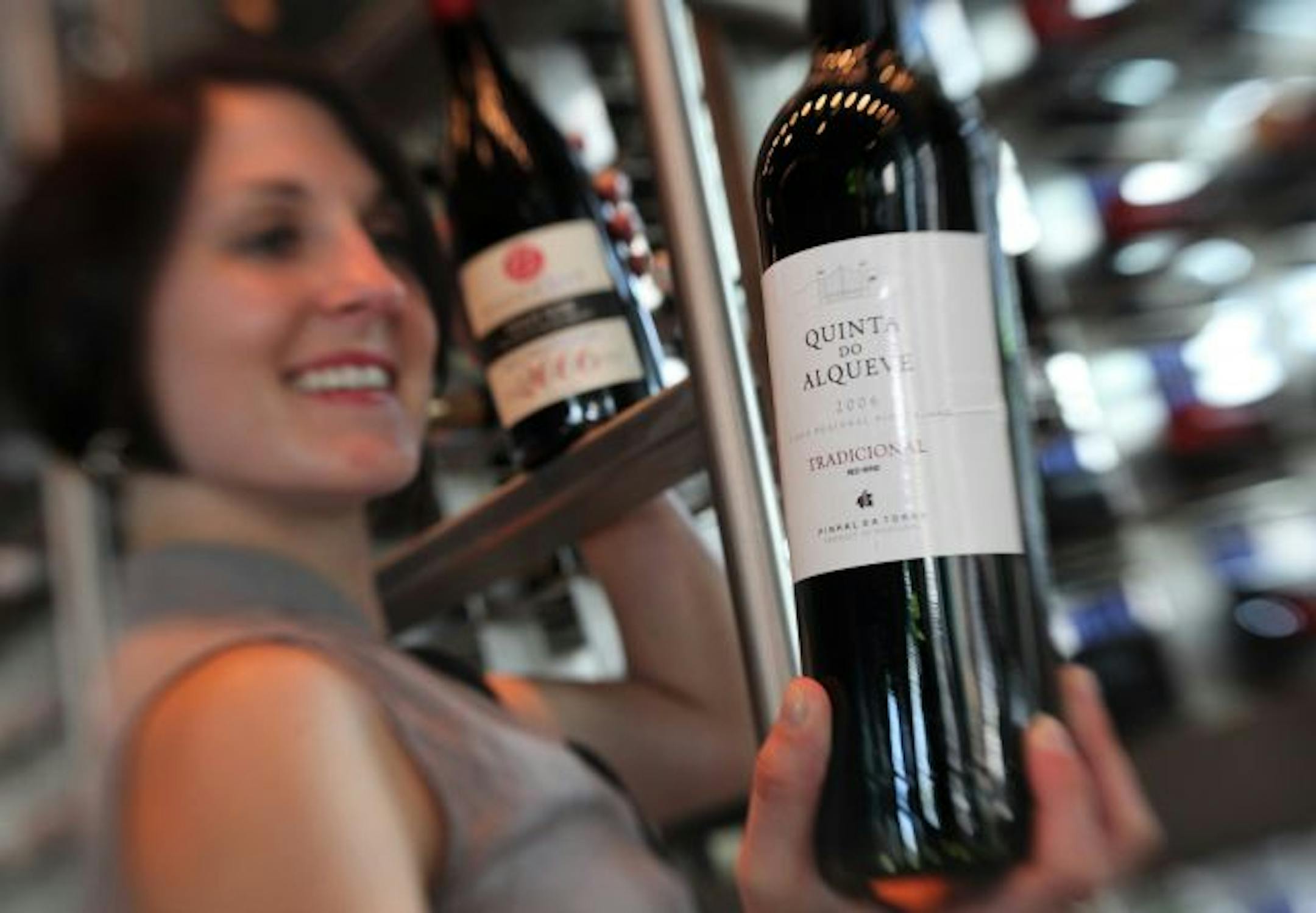 In an effort to keep people eating out, many restaurants are looking for more inexpensive wines and more by-the-glass options. Sea Change's Megan Kordus displays an approachable and affordable Portuguese red, Quinta do Alqueve, that the restaurant sells for $23 a bottle, or $7 a glass.