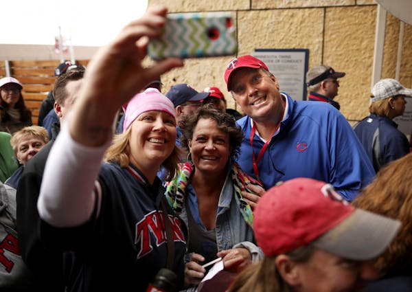Twins legend Kent Hrbek posed for a selfie with Laura Livermore, left, and Julie Tietje as they were about to enter at his namesake Gate 14 Monday aft