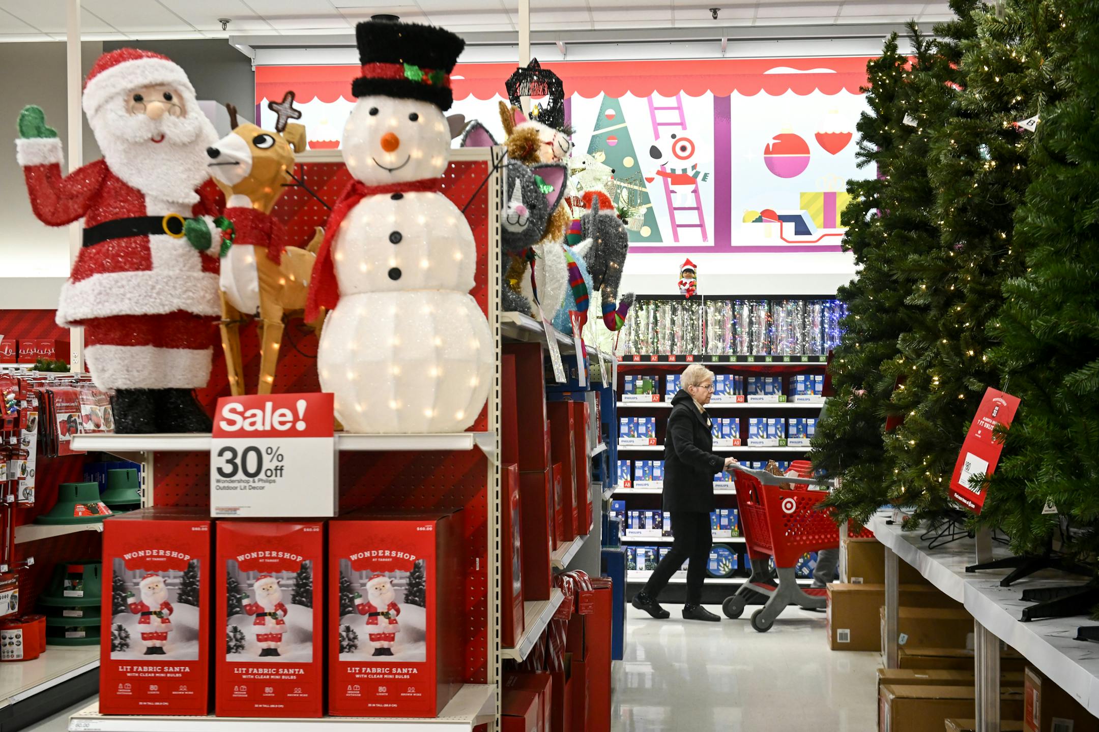 Kathryn Lindahl walked through the Ridgedale Target's "Wondershop" holiday display with her husband, Steve, Wednesday afternoon. They were shopping for "lights and any decorations we can find what will spruce up our place." ] Aaron Lavinsky &#xa5; aaron.lavinsky@startribune.com The unofficial kick-off to retailers' busiest season starts after the turkey is put back in the fridge on Thanksgiving. This send-up story will roll in the forecast for Minnesota from Deloitte and other expectations in th