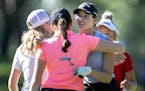 Kathryn VanArragon gets a hug after her round Wednesday, June 15, 2022 at Bunker Hills Golf Club in Coon Rapids, Minn. ] CARLOS GONZALEZ • carlos.go