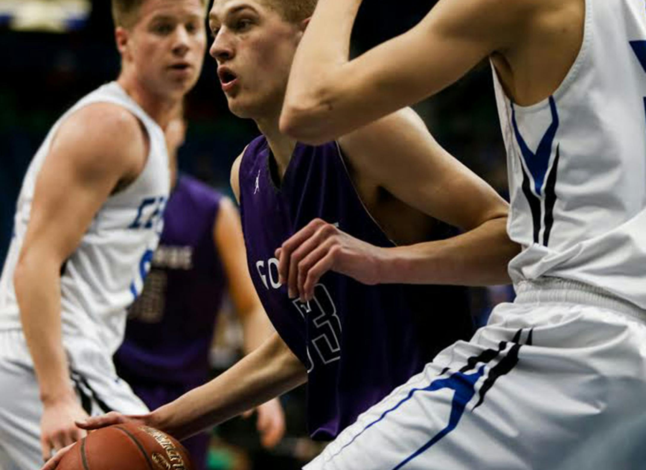 Goodhue Gaurd, Ben Opsahl, dribbles the ball against Central MN Christian defensive. ] ELIZABETH BRUMLEY brumley.elizabeth@gmail.com 2016 boys basketball state tournament * Central MN Christian vs. Goodhue, class 1A semi finals.