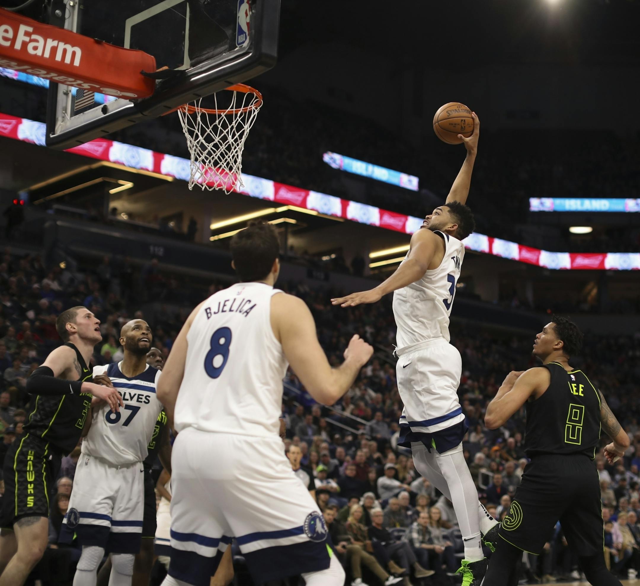 Minnesota Timberwolves center Karl-Anthony Towns (32) prepared a third quarter dunk for two of his franchise-record 56 points Wednesday night.