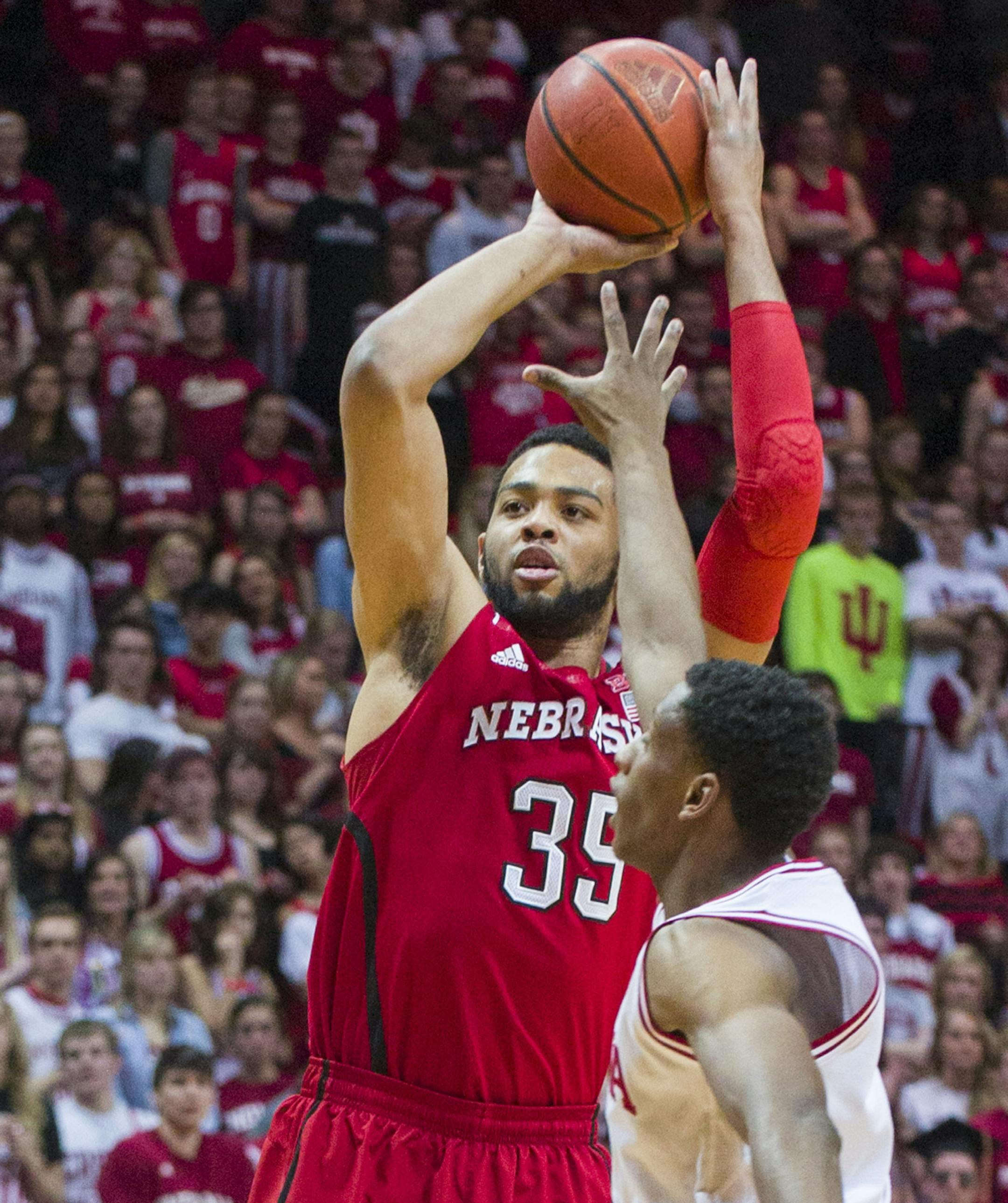 Nebraskaís Walter Pitchford (35) puts up a shot over Indiana's Troy Williams in the first half of an NCAA college basketball game, Wednesday, March 5, 2014, in Bloomington, Ind. (AP Photo/Doug McSchooler)