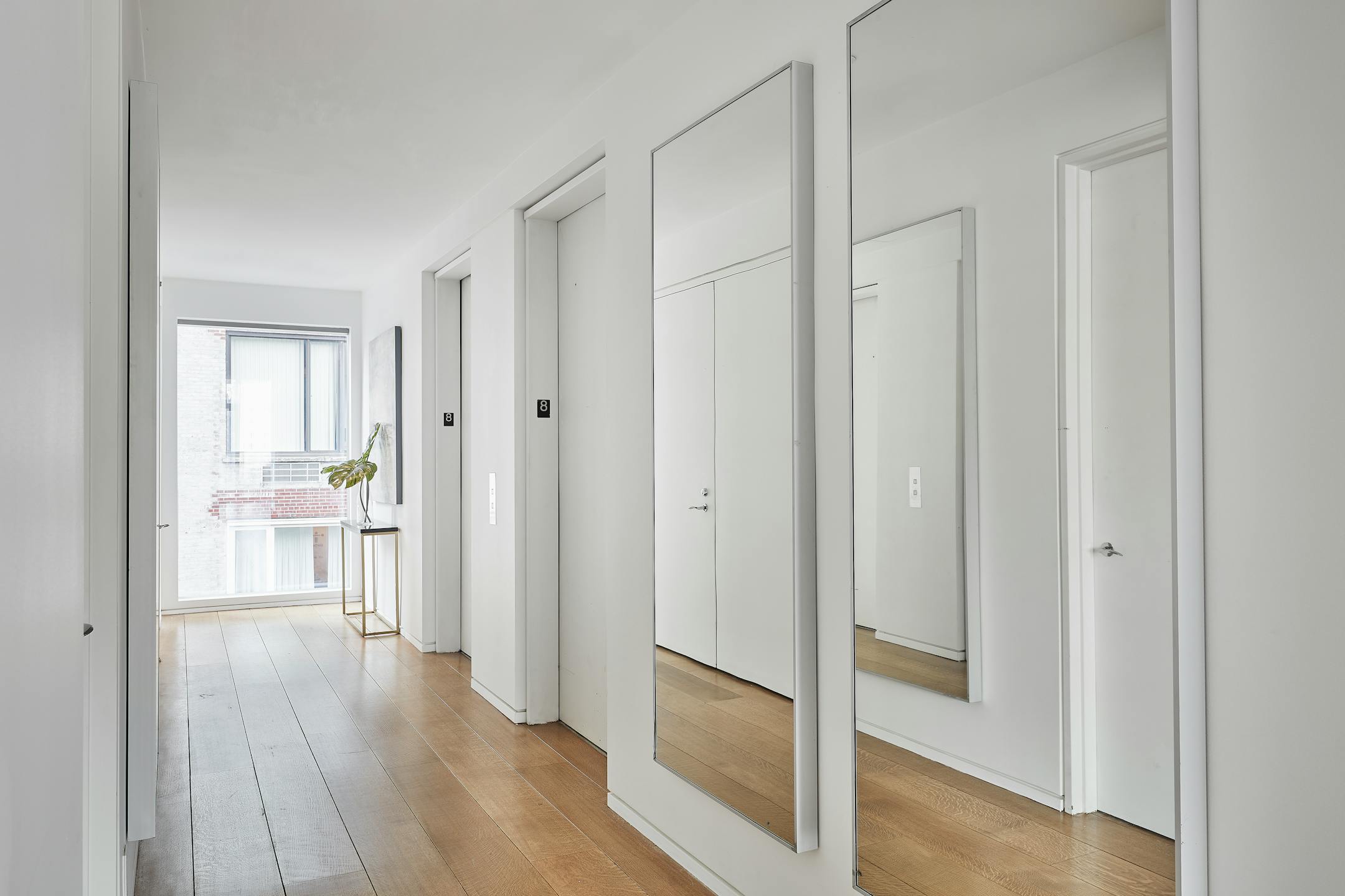 A hallway is made to feel longer and brighter through the use of mirrors. (Scott Gabriel Morris/TNS)