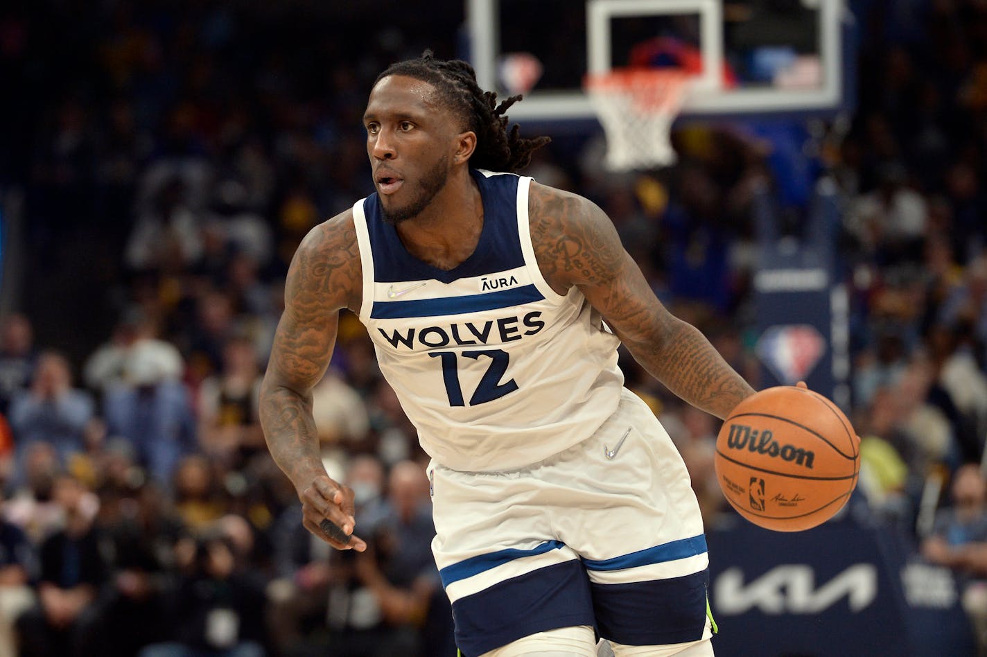 Minnesota Timberwolves forward Taurean Prince (12) handles the ball in the second half during Game 5 of a first-round NBA basketball playoff series against the Memphis Grizzlies Tuesday, April 26, 2022, in Memphis, Tenn. (AP Photo/Brandon Dill)