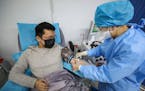 A doctor who had recovered from the COVID-19 coronavirus infection donated plasma in Wuhan, China.