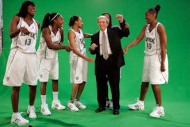 Lynx assistant coach Ed Prohofsky poses with players, from left, Chandi Jones, Eshaya Murphy, Navond Moore, Tamika Raymond (moving Prohofsky's arms fr