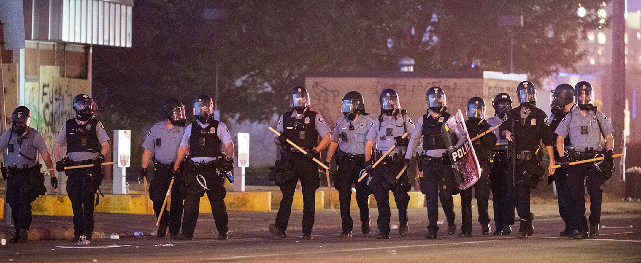 Minneapolis police have a huge presence outside the Minneapolis Police 5th Precinct after 9 p.m., keeping protesters away from the area with a show of force and chemical deterrents, on Saturday, May 30, 2020 in Minneapolis, Minn. (Leila Navidi/Minneapolis Star Tribune/TNS) ORG XMIT: 1676159