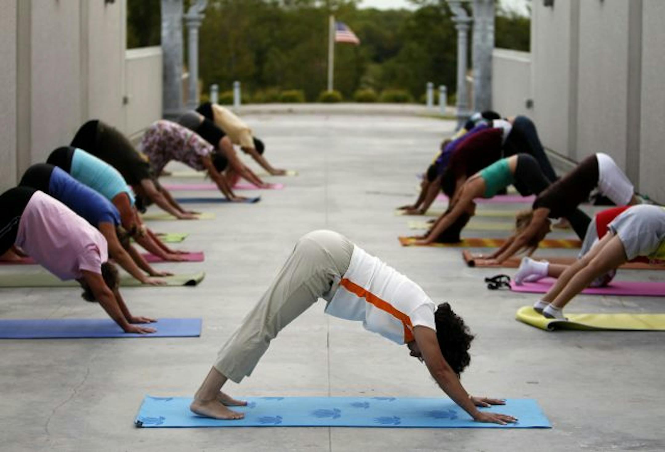Mythili Chari demonstrated "downward-facing dog" as the students moved through yoga's traditional "chaturanga," something that most yoga classes teach.