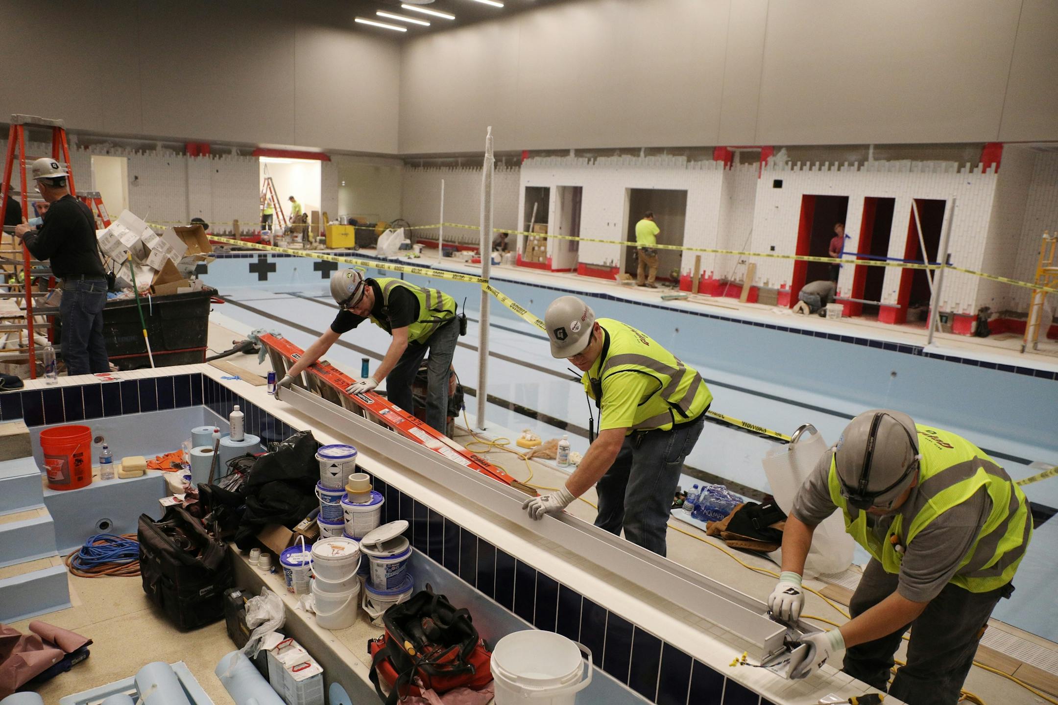 Construction workers installed part of the spa in the pool area which will open after the grand opening.