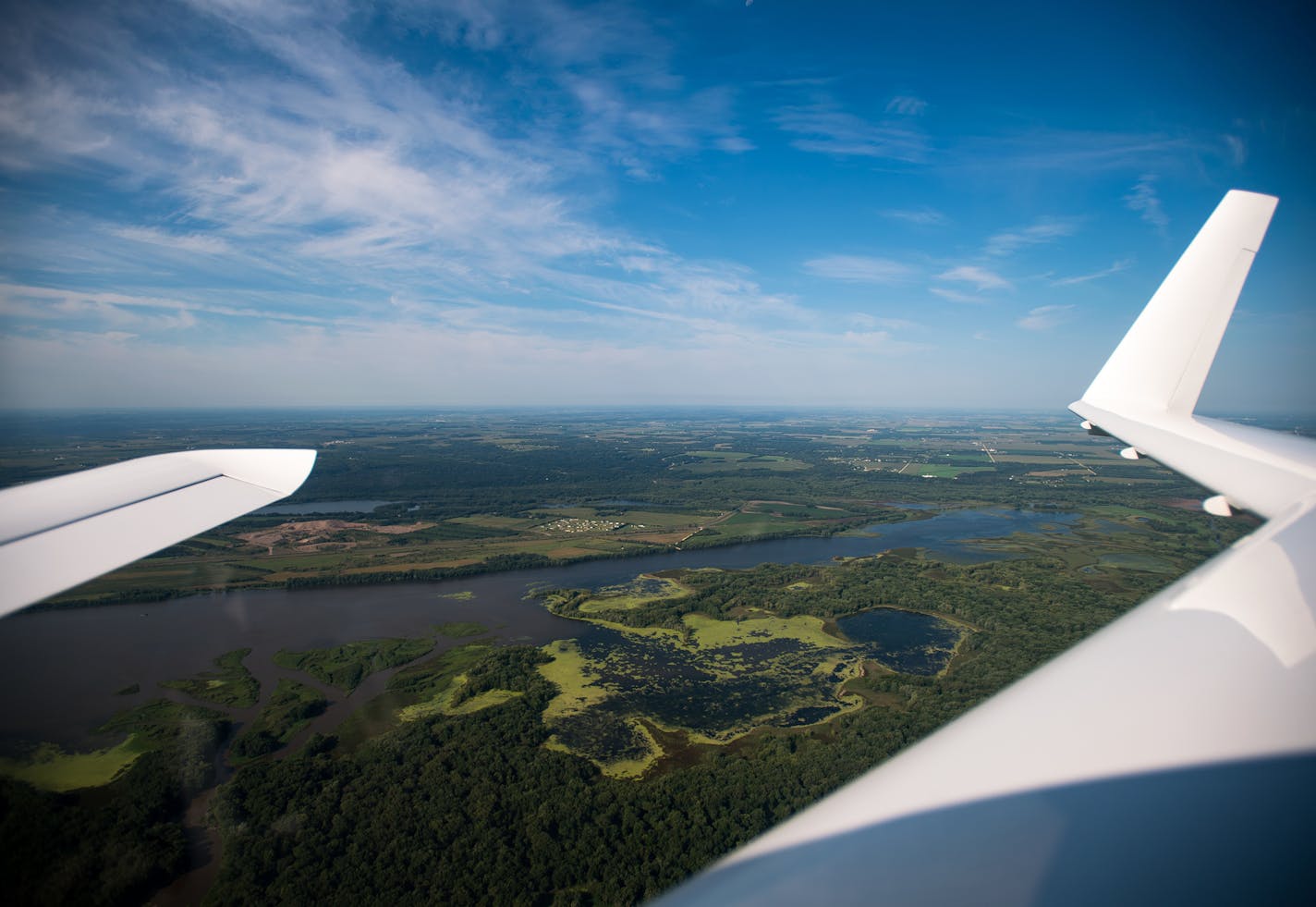 The view of blooming algae on the Mississippi River from Dave Nelson's experimental airplane Tuesday morning. ] (AARON LAVINSKY/STAR TRIBUNE) aaron.lavinsky@startribune.com Dave Nelson secured a tiny camera on the wing of an experimental plane he built in his garage, then hoisted himself into the cockpit, fired up the engine and guided it to Lake Pepin. At 3,500 feet, the Mississippi River looked blue and inviting. But on its edges Nelson pointed to lime-green algae blooms, and started snapping