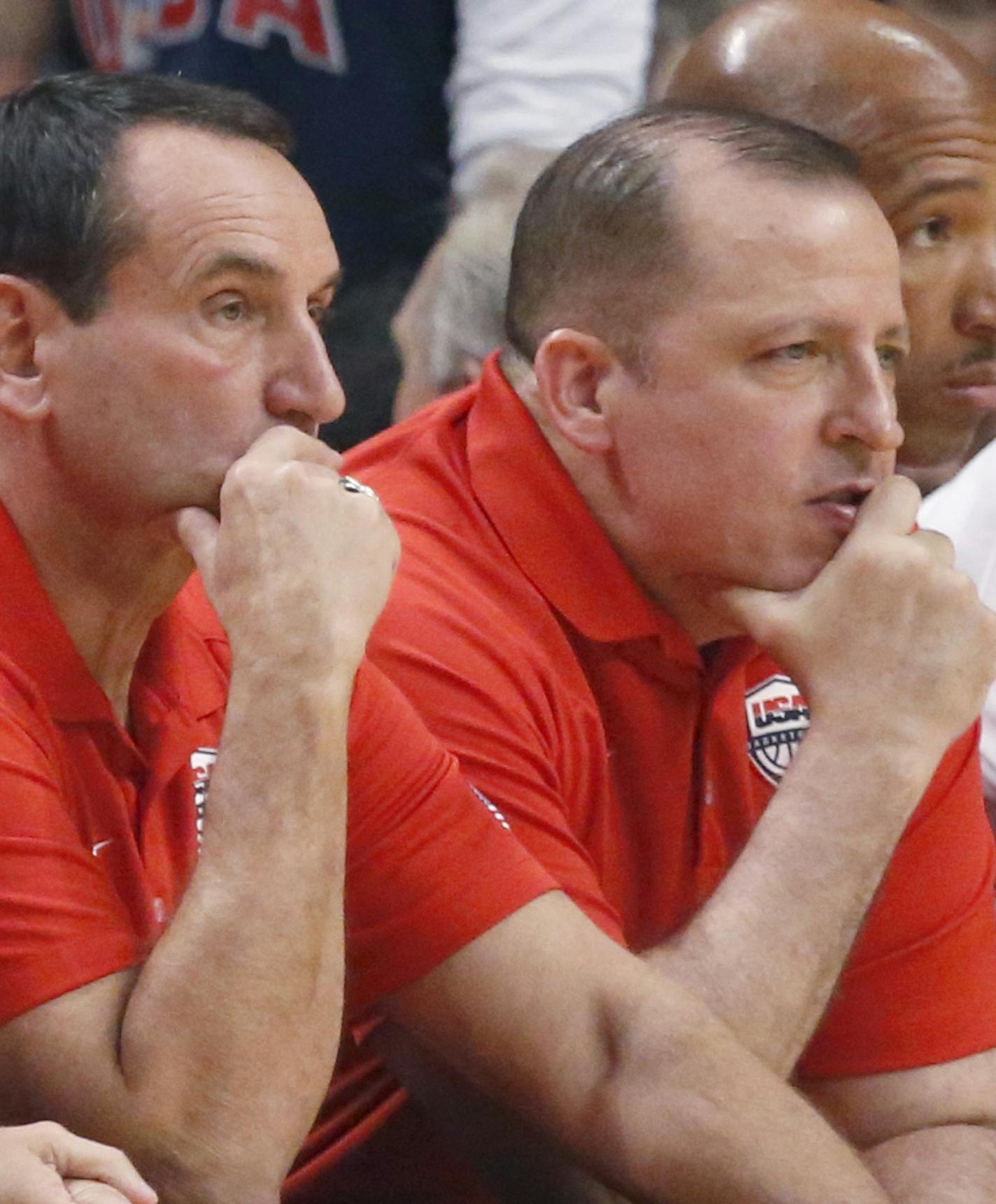 Coaches for the U.S. National from left, assistant coach Jim Boeheim, head oach Mike Krzyzewski, and assistant coach Tom Thibodeau watch during an exhibition game between the US and Brazilian national teams Saturday, Aug. 16, 2014, in Chicago. (AP Photo/Charles Rex Arbogast) ORG XMIT: CXA