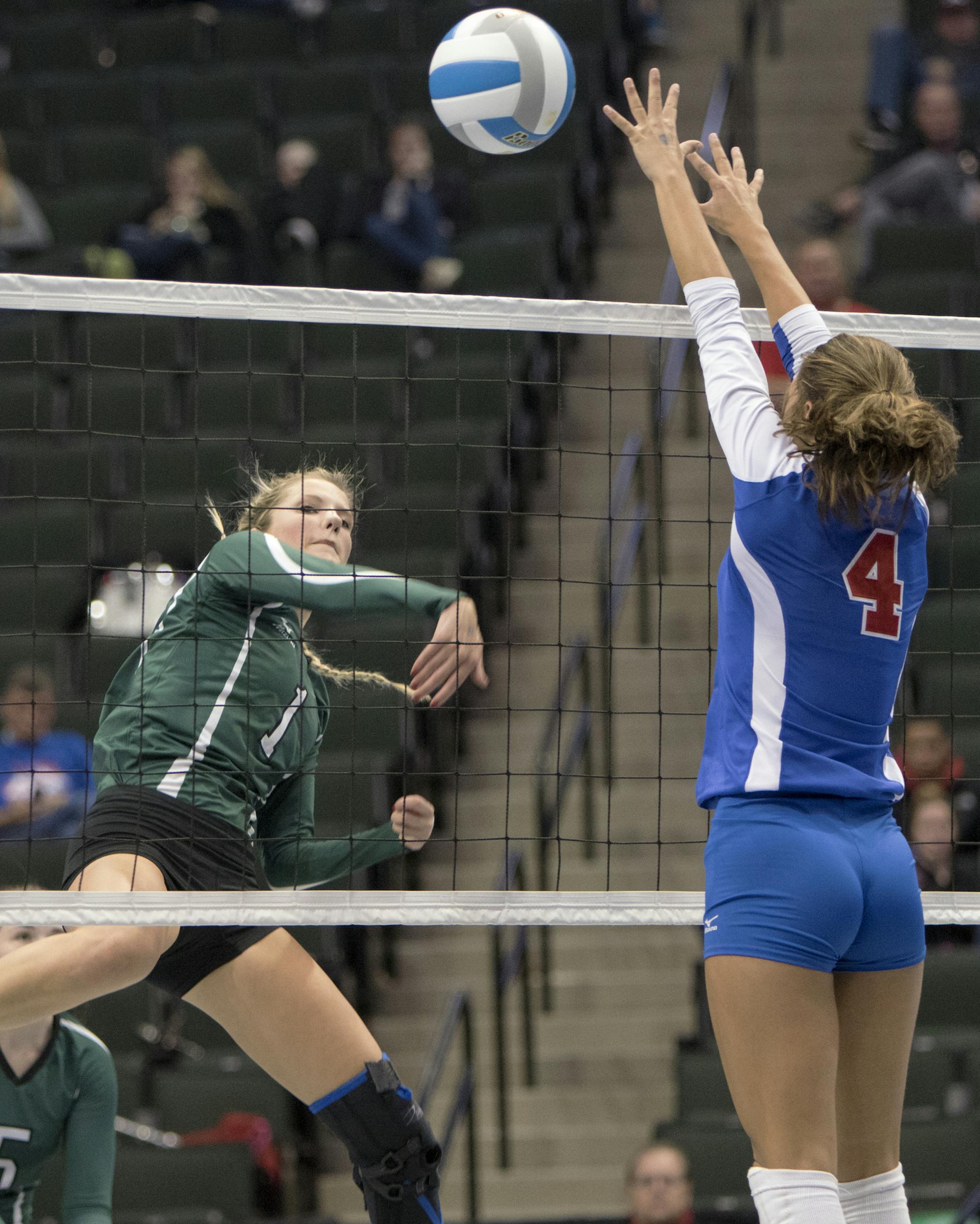 Kamryn Kendall (1) of Waterville-Elysian-Morristown picks up a kill past Tracy-Milroy-Balaton's Kendra Ludeman (4) as the Tracy-Milroy-Balaton Panthers faced the Waterville-Elysian-Morristown Buccaneers in the Class A volleyball semifinals. ] MATT BLEWETT ï matt@mattebphoto.com Special to Star Tribune - November 13, 2015, St. Paul, MN, Tracy-Milroy-Balaton, Waterville-Elysian-Morristown, 2015 MSHSL Volleyball Tournament, Tracy-Milroy-Balaton Panthers vs Waterville-Elysian-Morristown Buccane