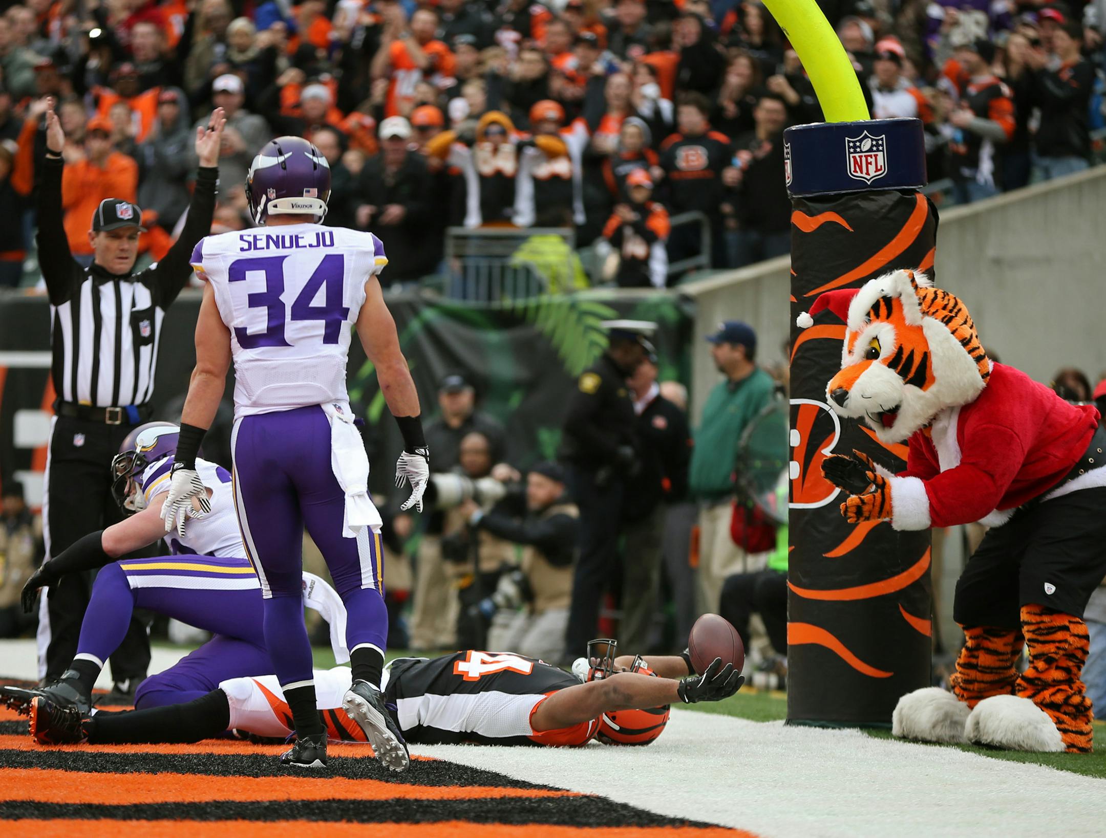 Vikings safeties Harrison Smith (22) and Andrew Sendejo (34) were unable to stop Bengals tight end Jermaine Gresham (84) from catching a 16-yard touchdown pass from quarterback Andy Dalton in the second quarter.. ] MCKENNA EWEN · mckenna.ewen@startribune.com Minnesota Vikings and Cincinnati Bengals - Paul Brown Stadium in Cincinnati, OH - 12/22/2013 ] MCKENNA EWEN · mckenna.ewen@startribune.com Minnesota Vikings and Cincinnati Bengals - Paul Brown Stadium in Cincinnati, OH - 12/22/2013