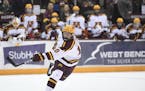 Minnesota Gophers defenseman Jackson LaCombe (10) attempted a shot against the Michigan State Spartans in the second period. ] Aaron Lavinsky &#x2022;