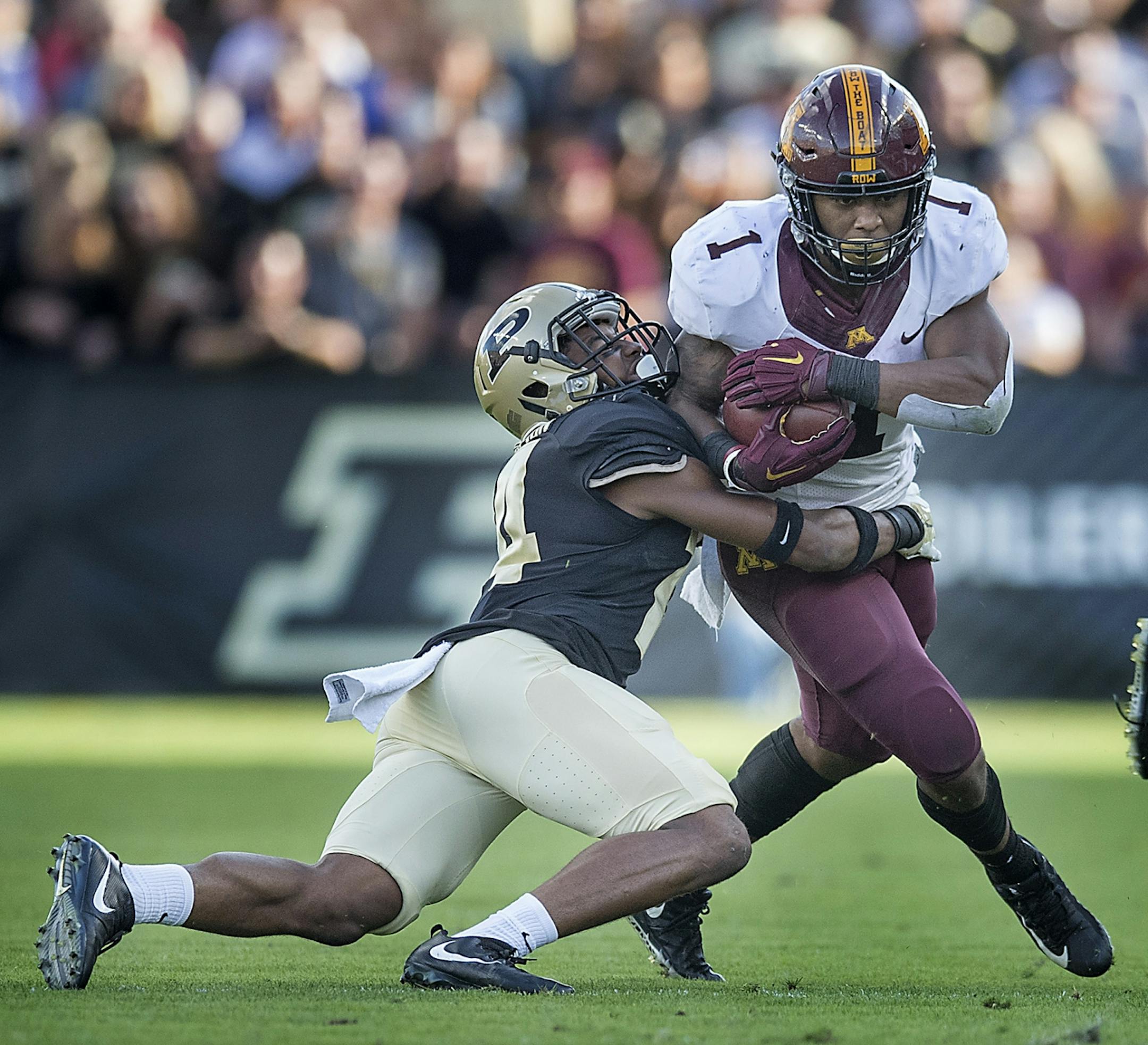 Minnesota's running back Rodney Smith plowed through Purdue's cornerback Antonio Blackmon during the second quarter the Gophers took on Purdue at Ross-Ade Stadium, Saturday, October 7, 2017 in West Lafayette, IN.