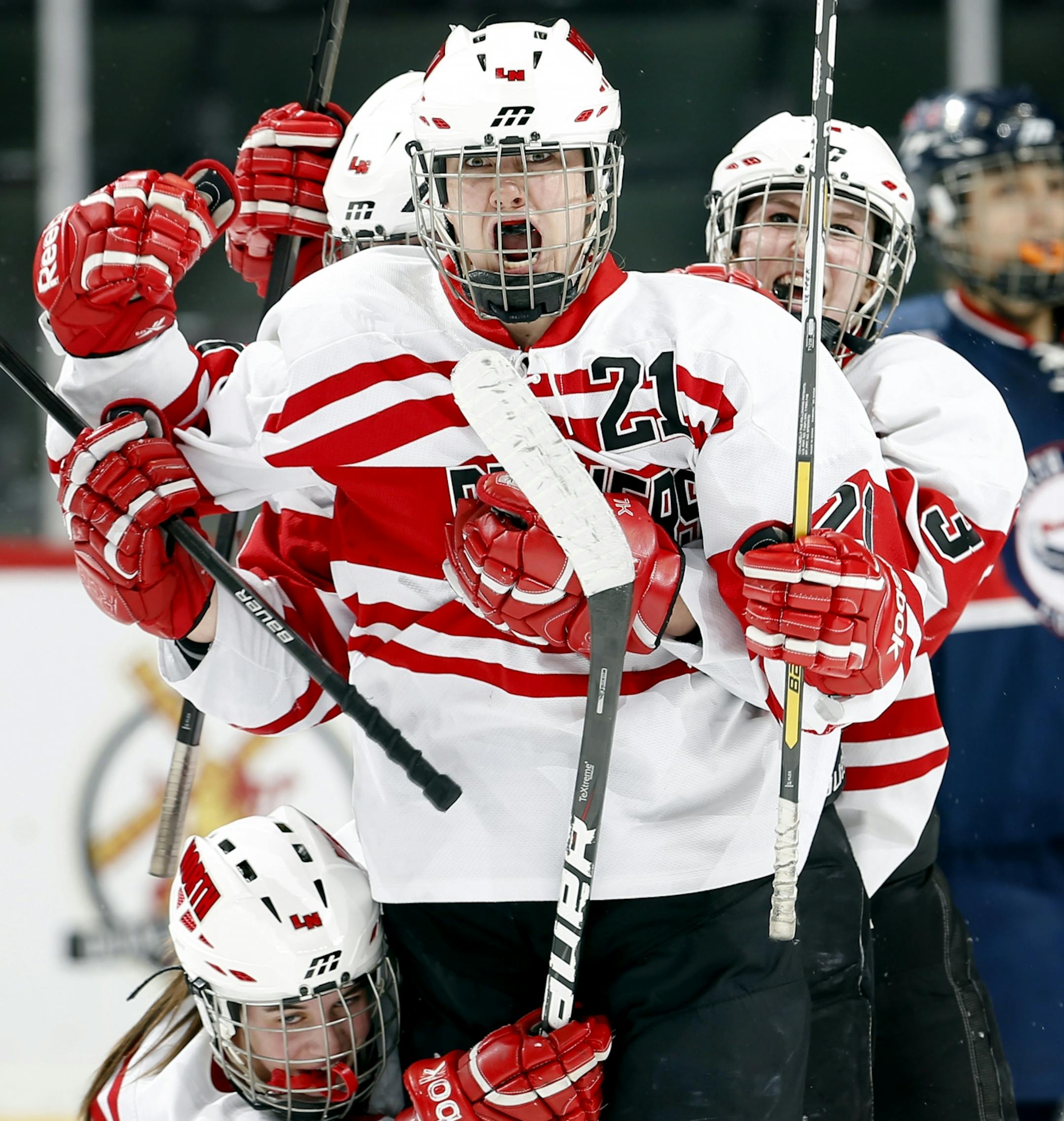 Lakeville North's Christi Vetter (21) celebrated after scoring the game winning goal in overtime. Lakeville North beat North Wright County 5-4 in overtime.