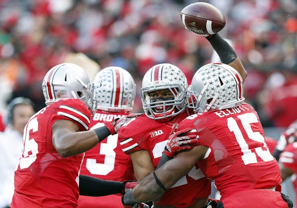Ohio State Buckeyes defensive back Ron Tanner (20) celebrates after recovering a blocked punt against Indiana Hoosiers during the second quarter at Oh