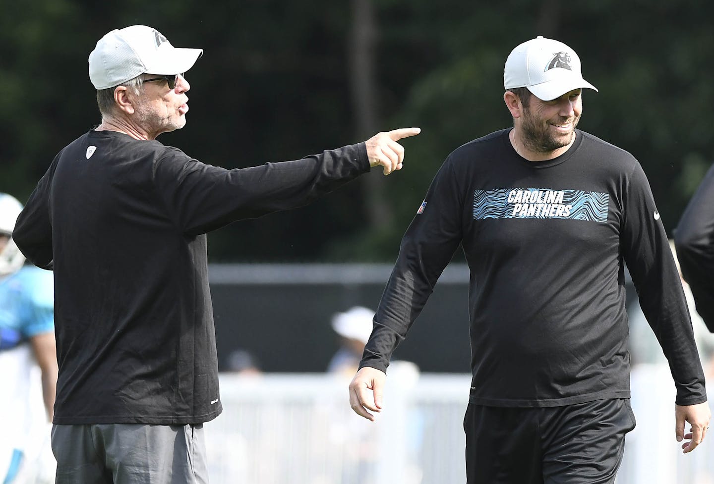 Carolina Panthers offensive coordinator Norv Turner, left, makes a point as quarterbacks coach, and son, Scott Turner looks on, during practice at training camp at Wofford College in Spartanburg, S.C. on Sunday, July 29, 2018. (David T. Foster III/Charlotte Observer/TNS)