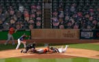Minnesota Twins second baseman Luis Arraez (2) was tagged out at home by Houston Astros catcher Martin Maldonado (15) in the fifth inning. His would h