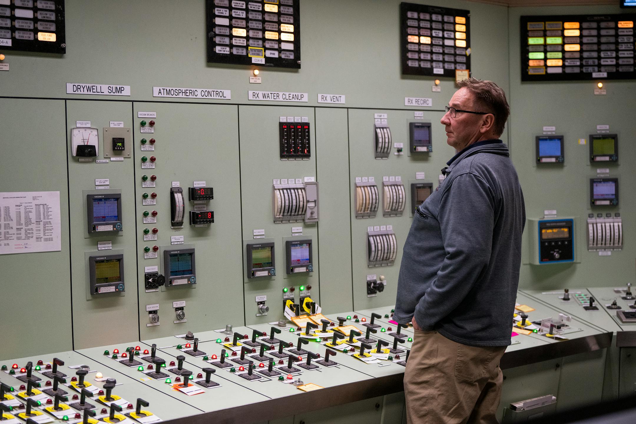 Reactor operator Gary Petersen works inside the main control room.