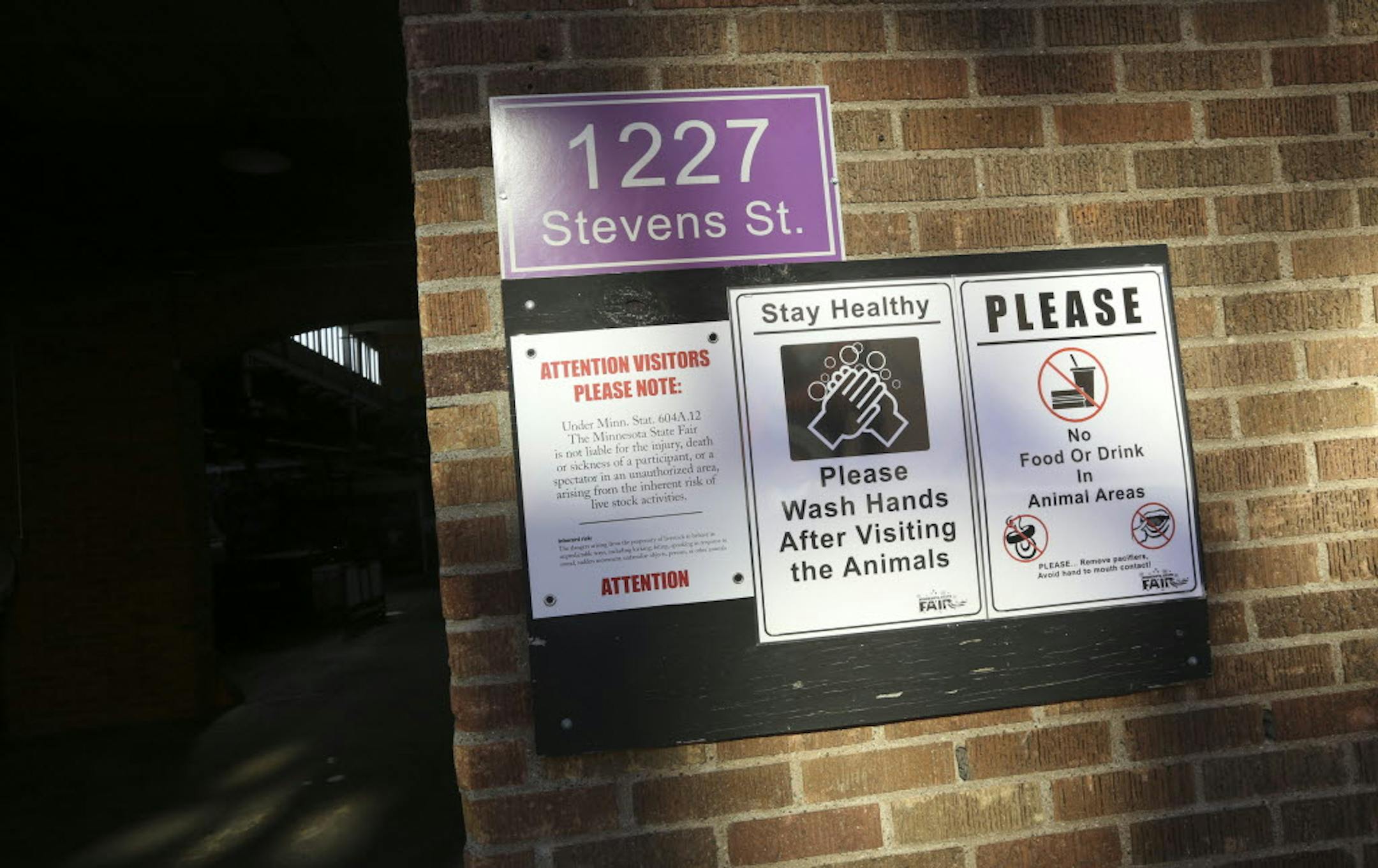 Signs remind visitors to wash their hands in the Swine Barn at the Minnesota State Fair.