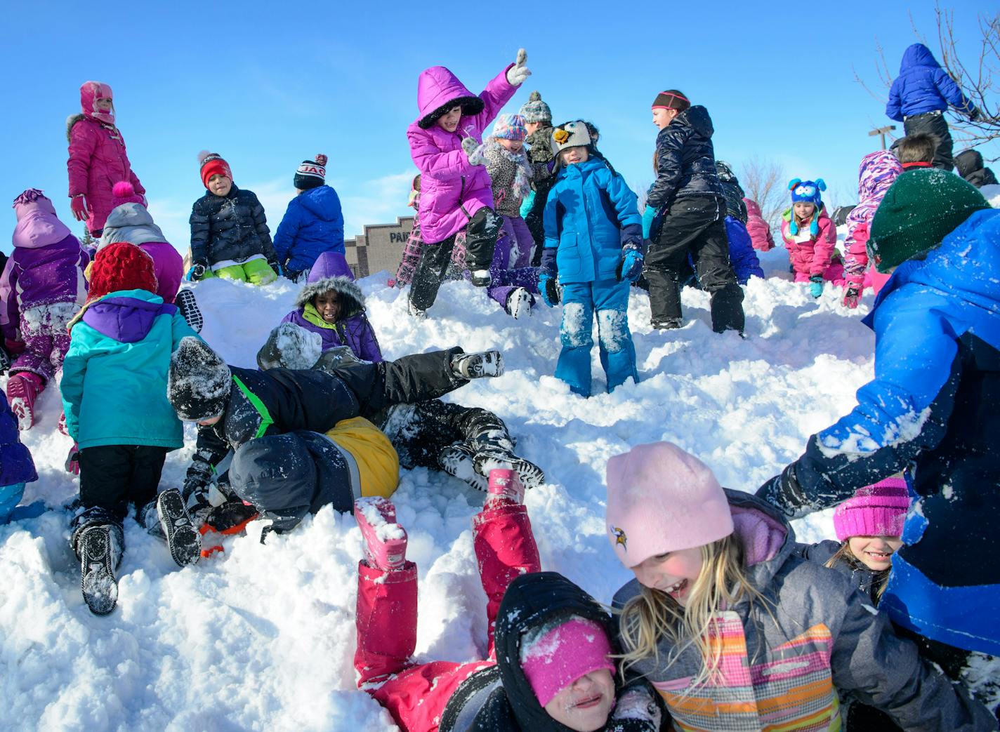 Students at Paideia Academy love it when the snow falls. For recess, they get to bundle up in their snowpants, boots and mittens and leap off of, or roll down the huge mountains of snow pushed off of their paved play area. Conditions were perfect for snow rolling Wednesday after a foot of snow fell in the south suburbs. Paideia Academy is a Public Charter School for Grades K-8 Located in Apple Valley. ] GLEN STUBBE * gstubbe@startribune.com Wednesday, February 3, 2016