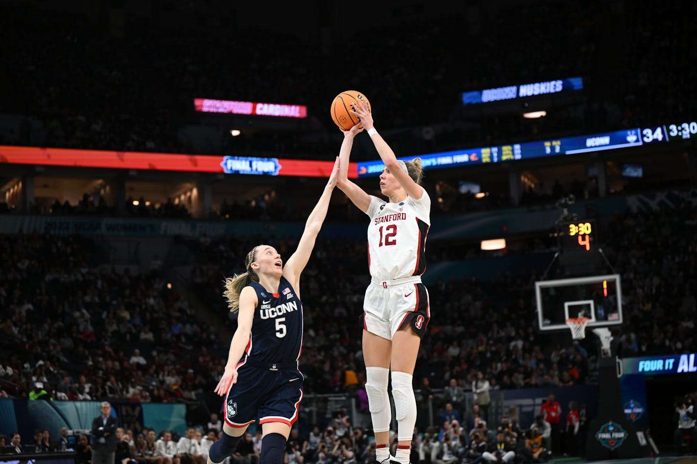 UConn guard Paige Bueckers defends Stanford guard Lexie Hull during Friday's semifinal at Target Center. Hull missed all four of her three-point attempts