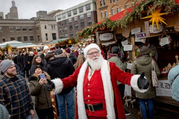 “Ho, Ho, Ho,” shouts out Santa Claus, also known as Paul Hollen as he visits with patrons at the annual European Christmas Market outside the Unio