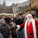 “Ho, Ho, Ho,” shouts out Santa Claus, also known as Paul Hollen as he visits with patrons at the annual European Christmas Market outside the Unio