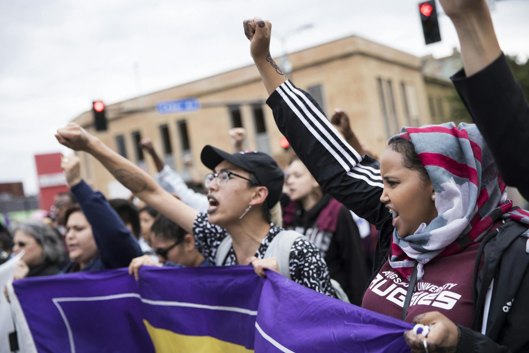 From the left; June Kuoch, 20, and Shamsa Ahmed, 18 marched in a protest through Minneapolis after President Donald Trump announced her plans to rescind DACA on Tuesday, September 5, 2017, Minneapolis, Minn.